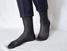 Charger l'image dans la galerie, TITTIMITTI men’s anthracite grey Filo di Scozia mercerized cotton dress socks with a geometric knit pattern, worn with rolled navy suit trousers